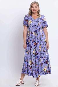 Full front view of woman in Jane empire waist violet floral maxi dress
