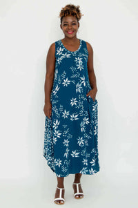 Full front view of woman in blue floral sleeveless summer midi dress