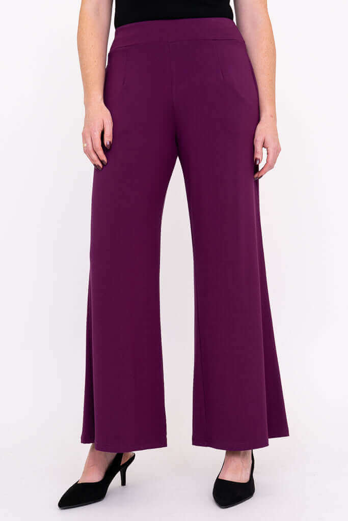 Full front of wide leg plum bamboo pants styled with black heels