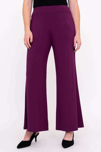 Full front of wide leg plum bamboo pants styled with black heels