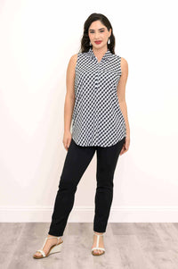 Full front view of a woman wearing a gingham sleeveless tank top and black pants