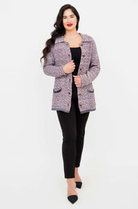 Model in full outfit wearing Chanel Cardigan and black pants, front view
