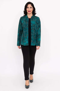 Full body front view of woman in teal mandarin blouse and black pants