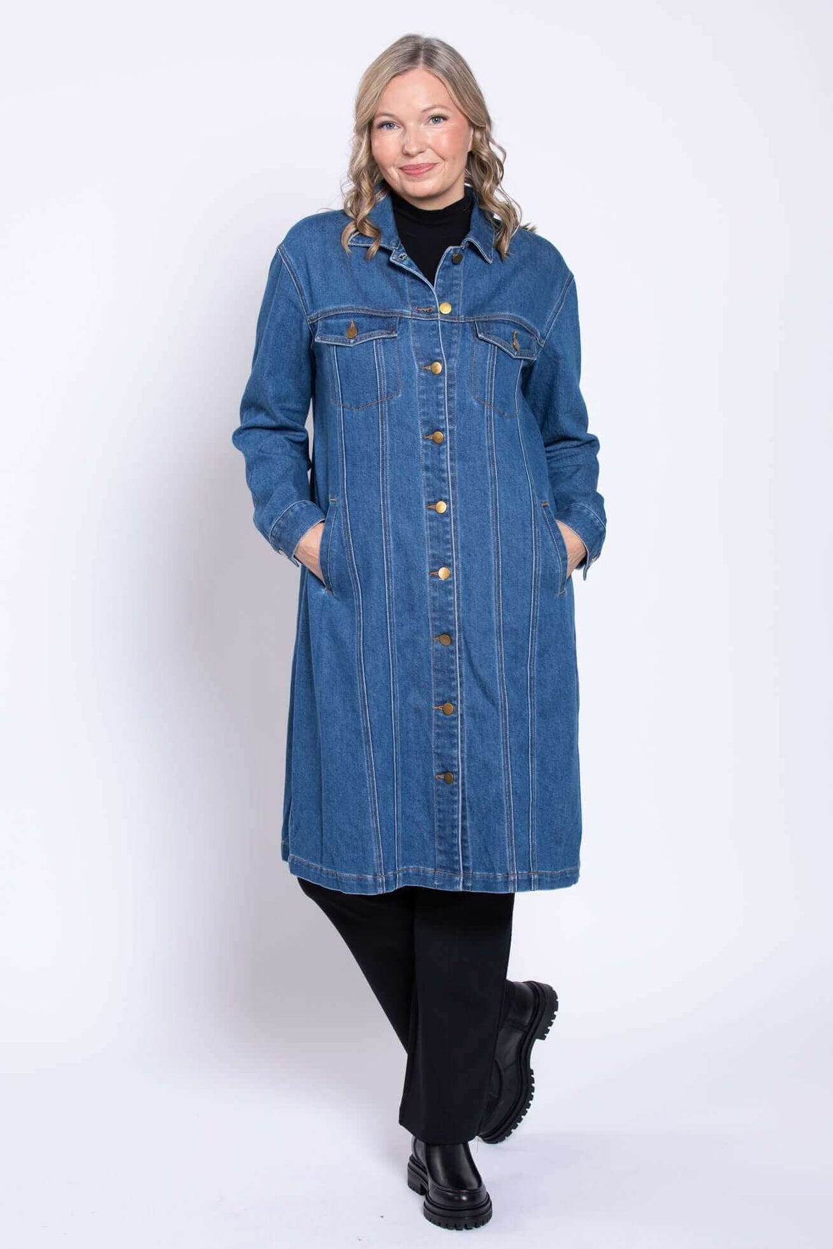 Full front pose of model in Geraldine longline denim jacket