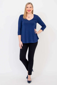 Full front view of woman standing in Jackie navy V-neck bamboo top
