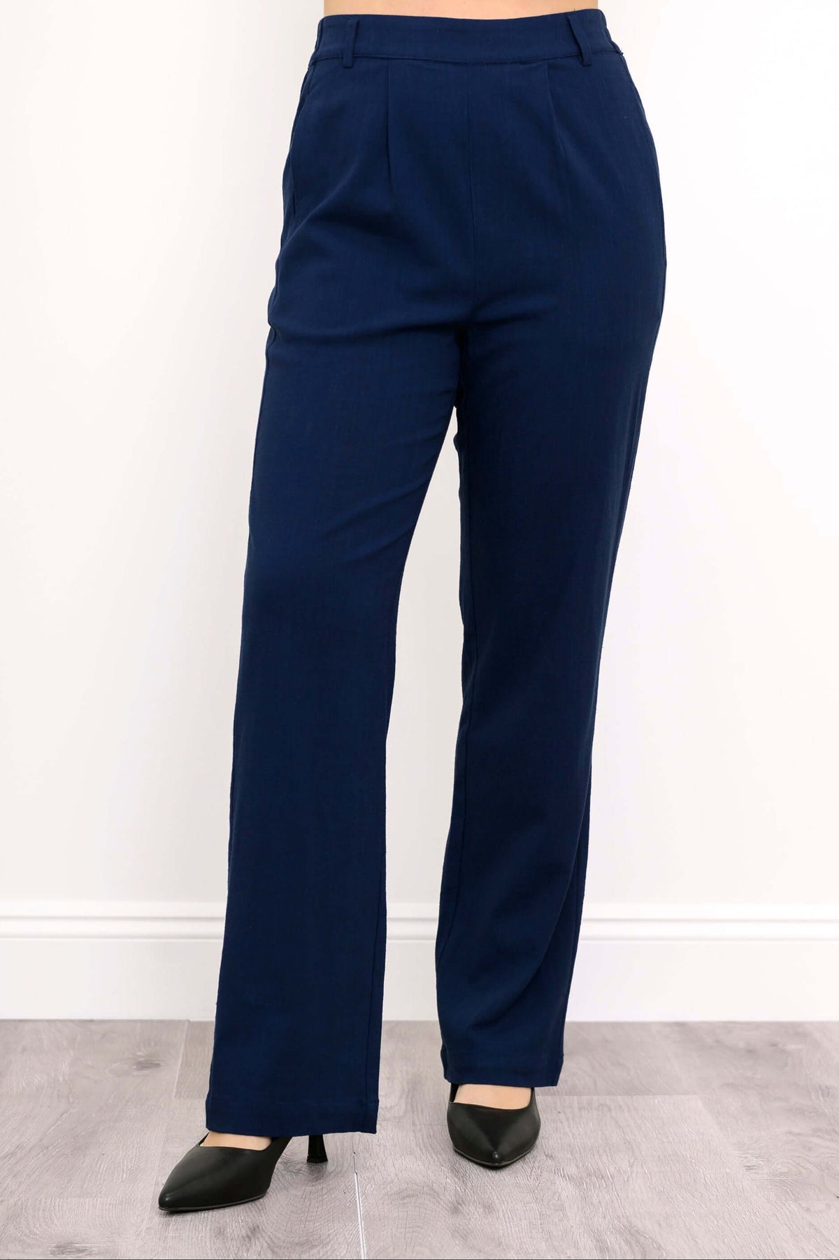 Full front view of navy Melodie pants with black heels