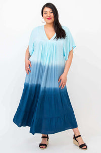 Woman modeling blue ombre tiered maxi dress facing forward