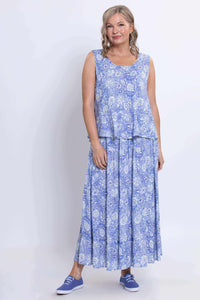 Full front view of model wearing a sleeveless peplum blue tank and matching skirt