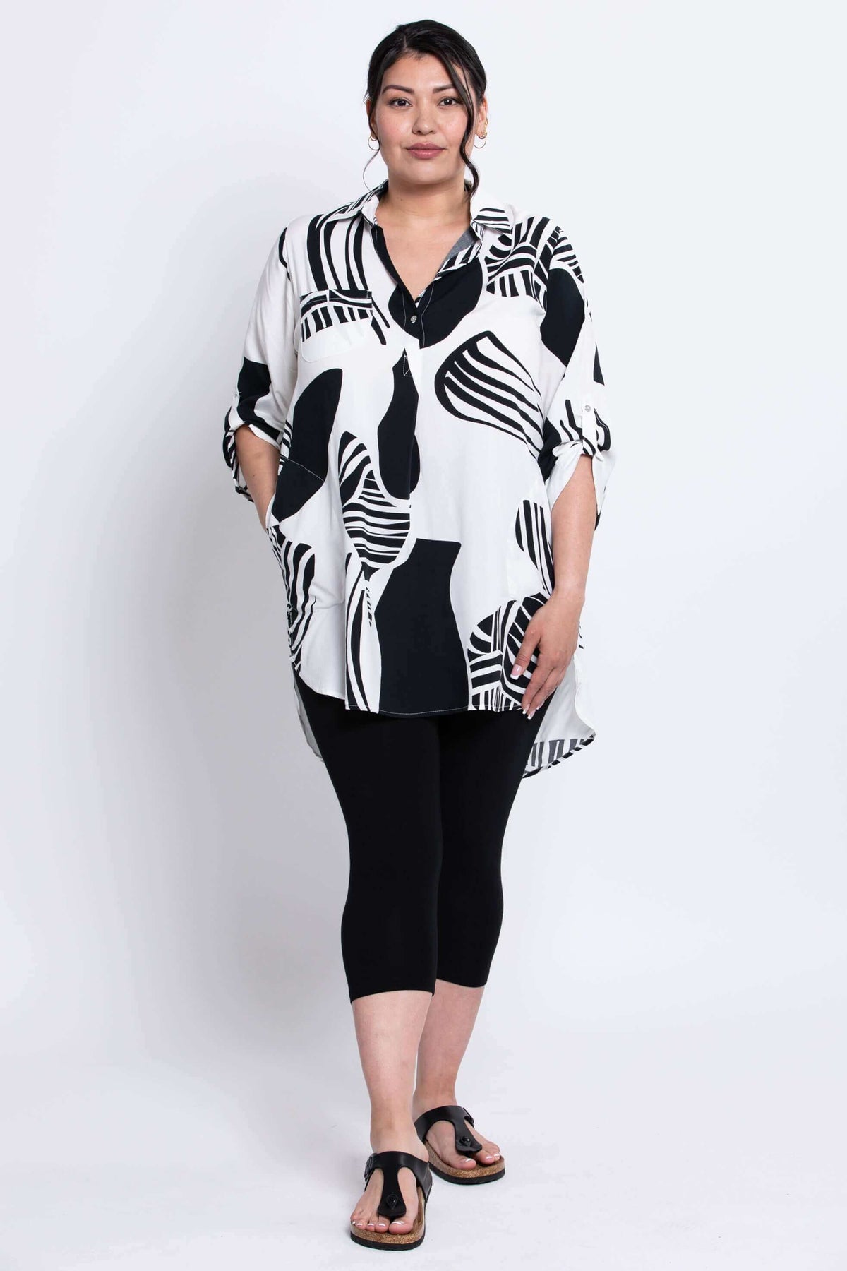 Full front view of Queenie Tunic with pockets and high-low hem on model