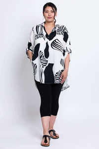 Full front view of Queenie Tunic with pockets and high-low hem on model