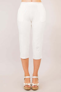 Full front view of white Susan Capri pants worn with white wedge sandals