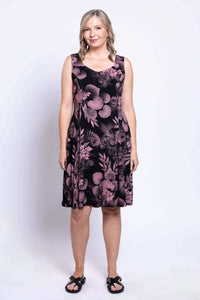 Full-length front view of woman in a black dress with pink floral print