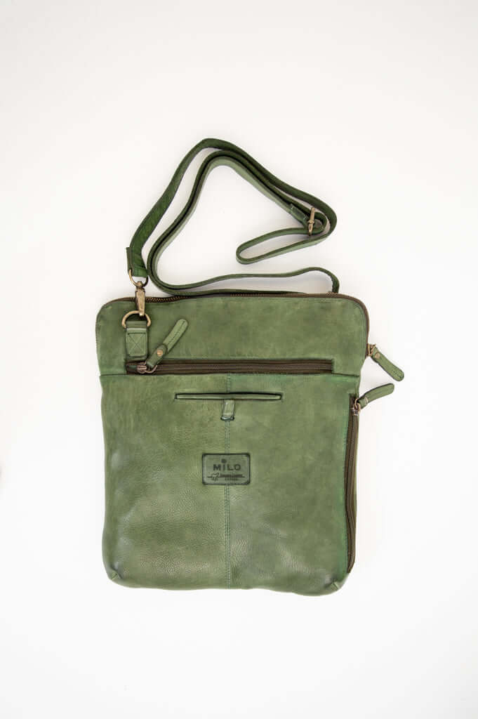 Full front view of green leather crossbody bag with adjustable strap