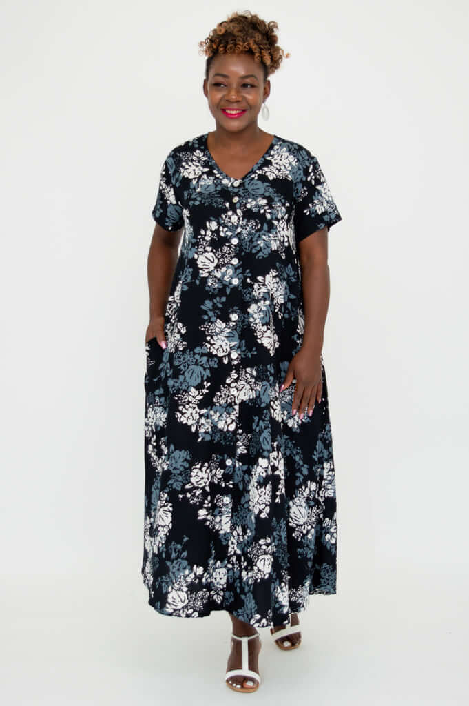 Full front view of model in a floral A-line dress with short sleeves
