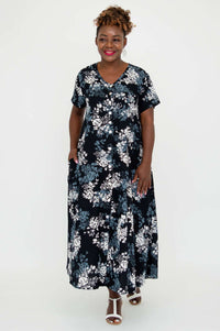 Full front view of model in a floral A-line dress with short sleeves