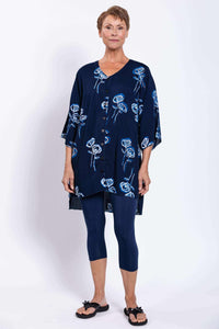 Full front view of woman in navy Darla blouse tunic and matching leggings