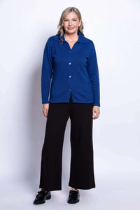 Full front view of woman in royal blue buttoned Lily Cardigan, black pants and shoes