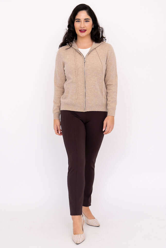 Woman wearing beige zip-front hoodie, front full body view