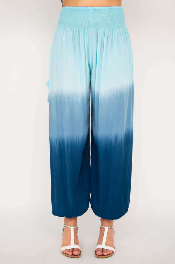 Full frontal view of Embra ombre blue pants showing elastic ankle cuffs