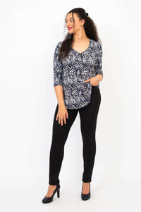 Full length front view of model in Jackie V-Neck Bamboo Top and black pants
