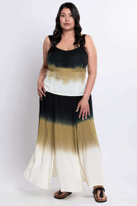 Woman modeling an ombre maxi skirt with multiple slits, showing full length, front view