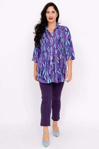 Full body shot of woman in Cindy dragonfly violet tunic and violet pants, facing forward