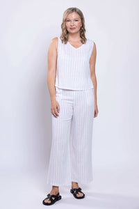Full body view of model in white striped sleeveless tank and matching pants