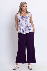 Model showing full outfit with Ginny floral peplum tank top and wide-leg purple pants