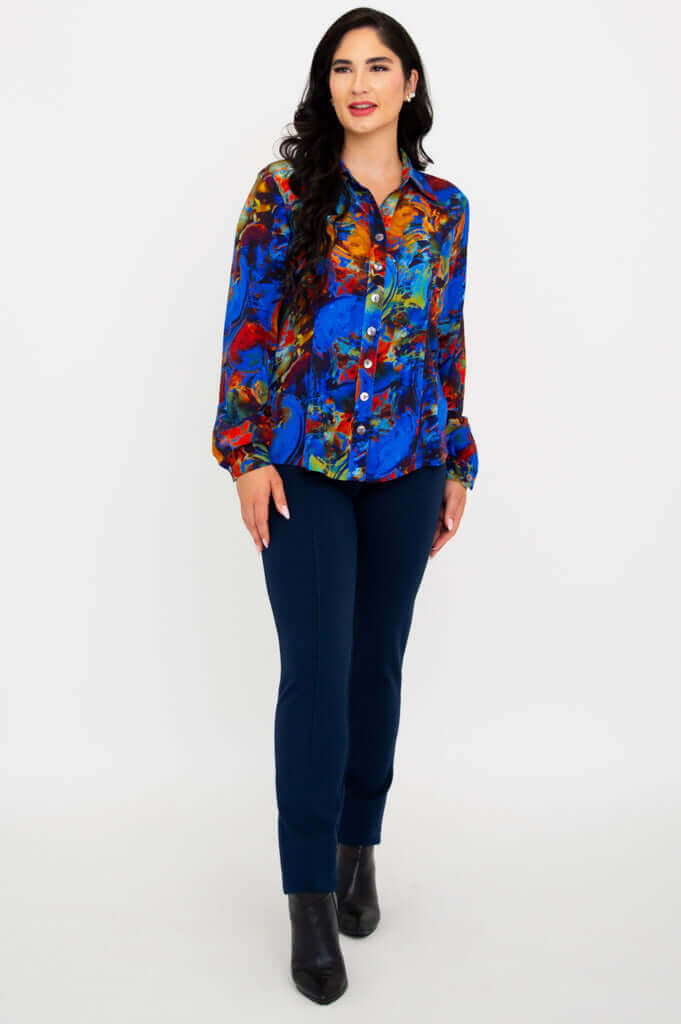 Full-length view of woman modeling Linzy blouse with blue pants
