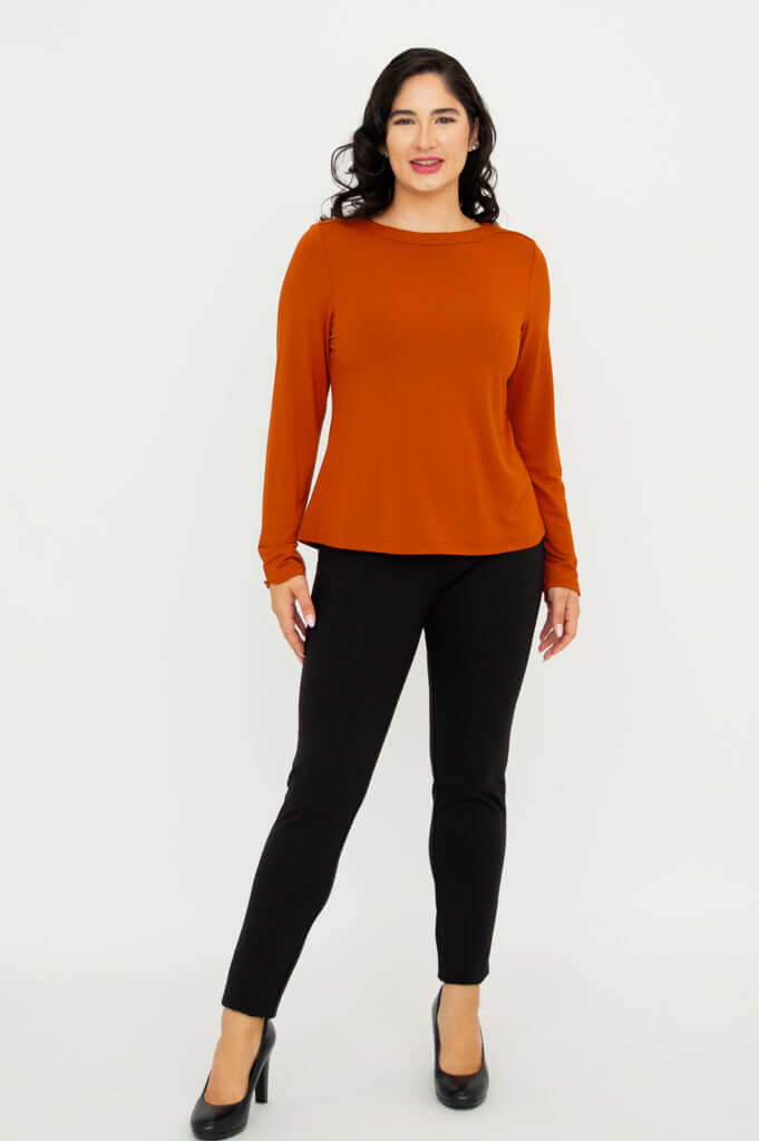 Full body front view of model in Mona Bamboo French Terry Tee paired with black pants