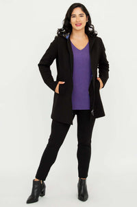 Full body front view of model in The Highlands Coat with one hand in pocket