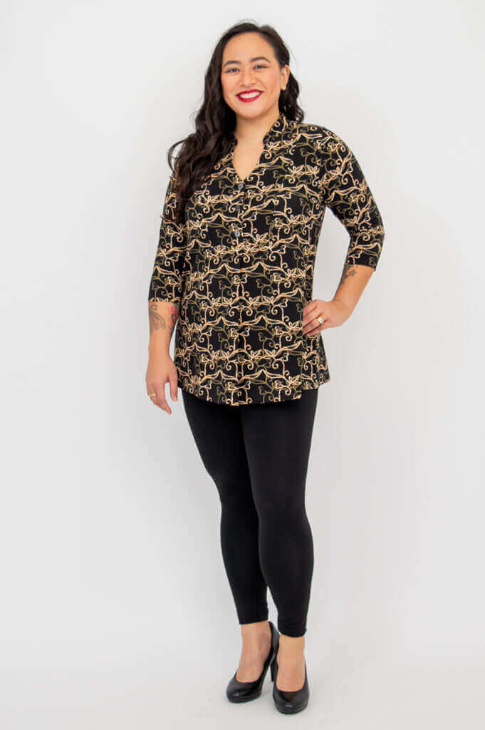 Full body view of woman in Edwina bamboo top and black leggings