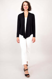 Full view of model in black open-front cardigan and white cropped pants