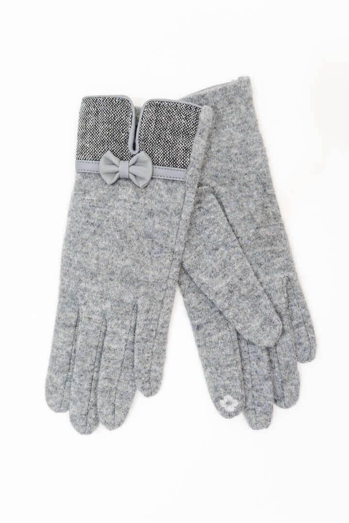 Pair of gray wool gloves with bow accent and touchscreen tips, displayed flat on a white background