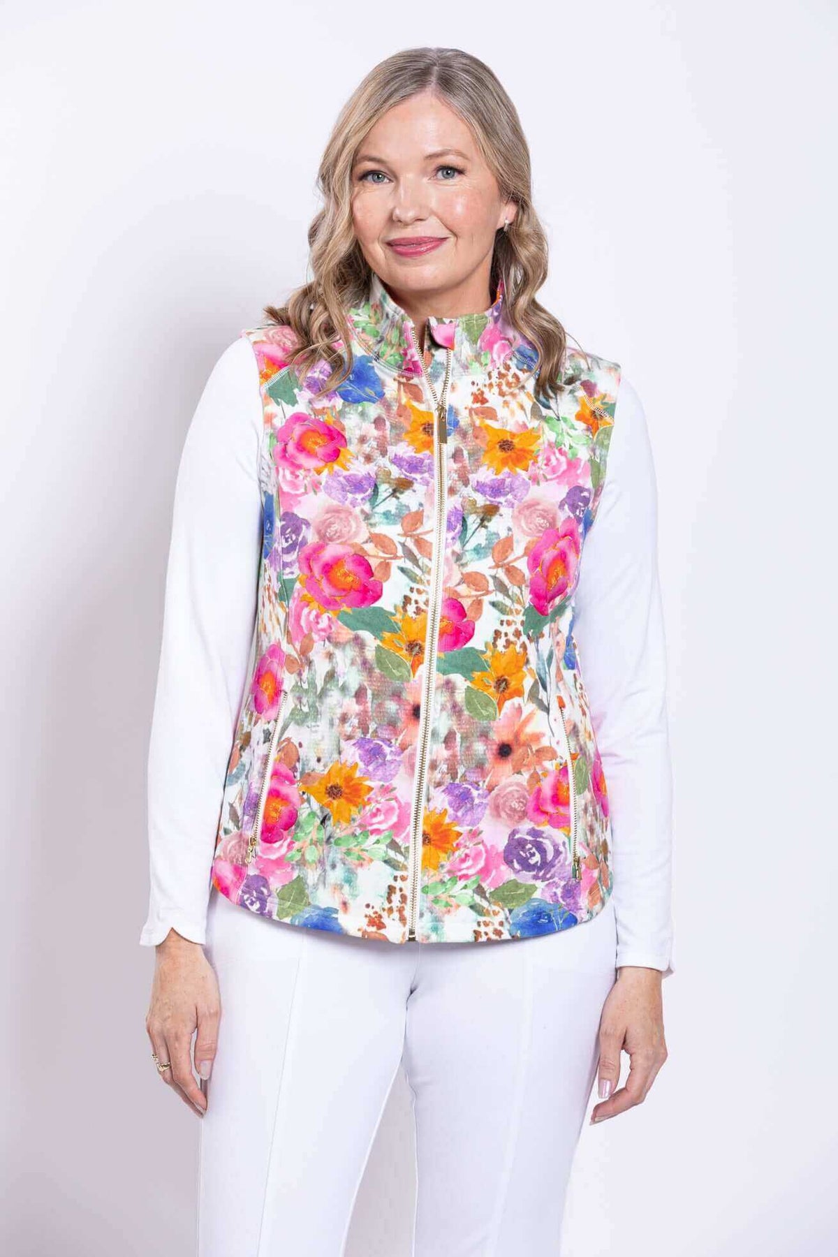 Front view of woman wearing a Hartford Pink Print Vest with vibrant floral pattern