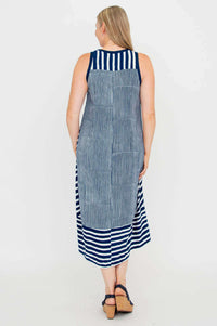 Back view of sleeveless navy and white striped hi-lo dress with contrast neckline
