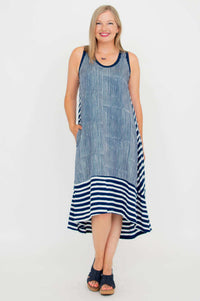 Front view of navy and white hi-lo dress with pockets styled for summer