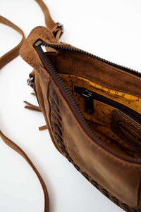 Interior of Terra Rustic Crossbody Bag displaying zippered compartment and lining