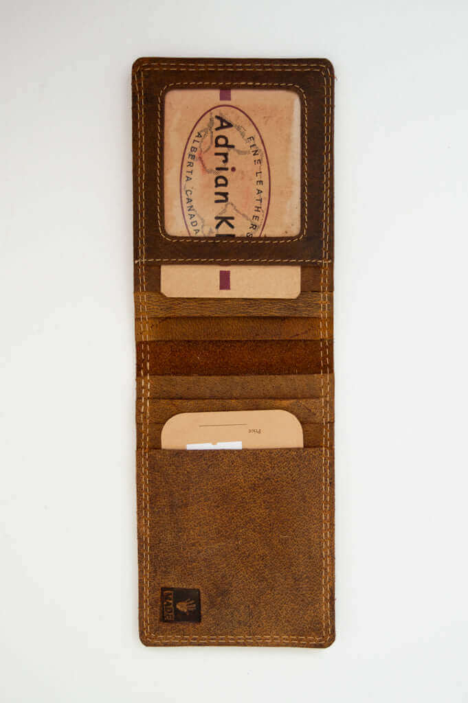 Interior of brown wallet showing card slots and ID window