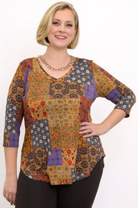 Yellow patchwork bamboo V-neck top with 3/4 sleeves, styled with brown trousers against a white background.