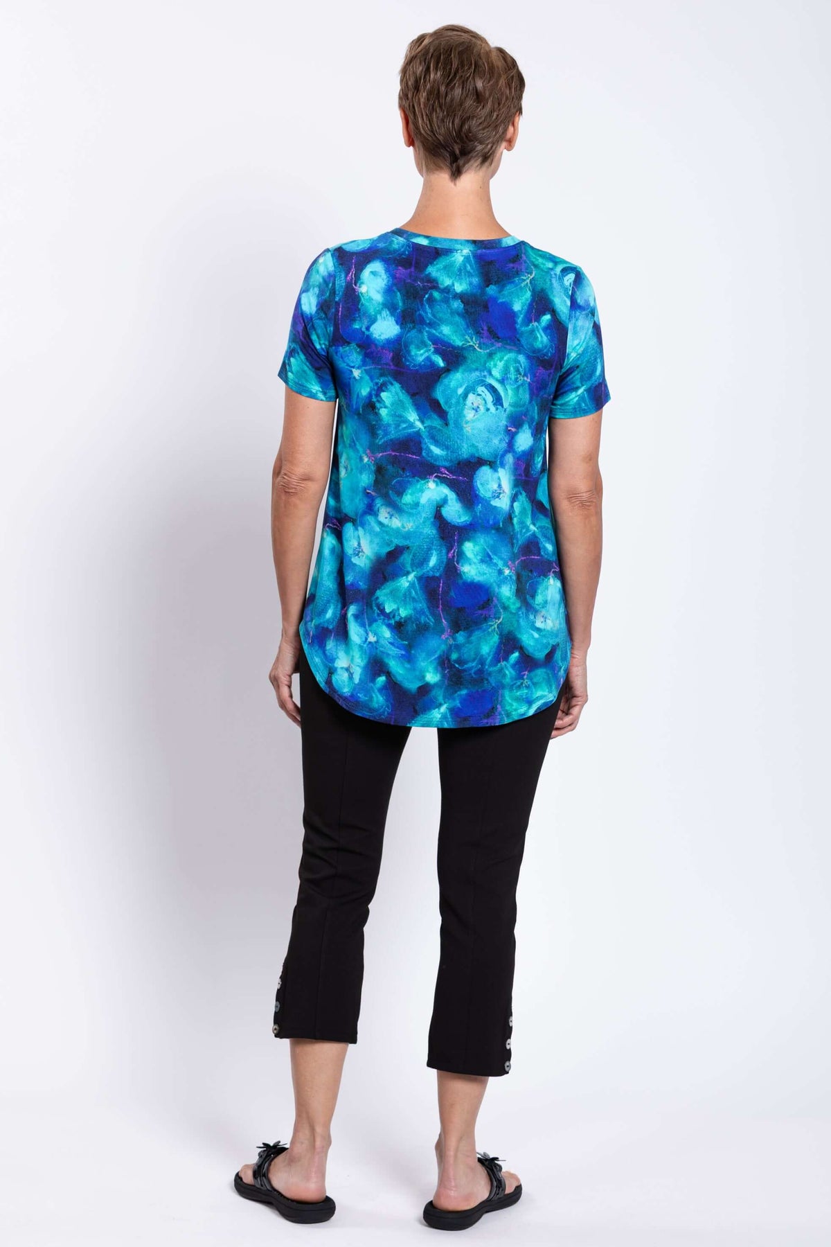 Back view of woman in Jackie Bamboo Top and black cropped pants