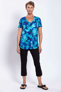 Front view of woman in Jackie Bamboo Top paired with black cropped pants