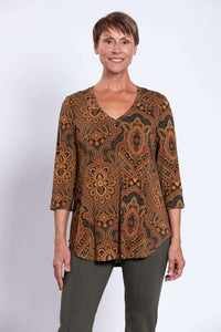 Front view of woman wearing Jackie V-neck bamboo top with earth-tone paisley print