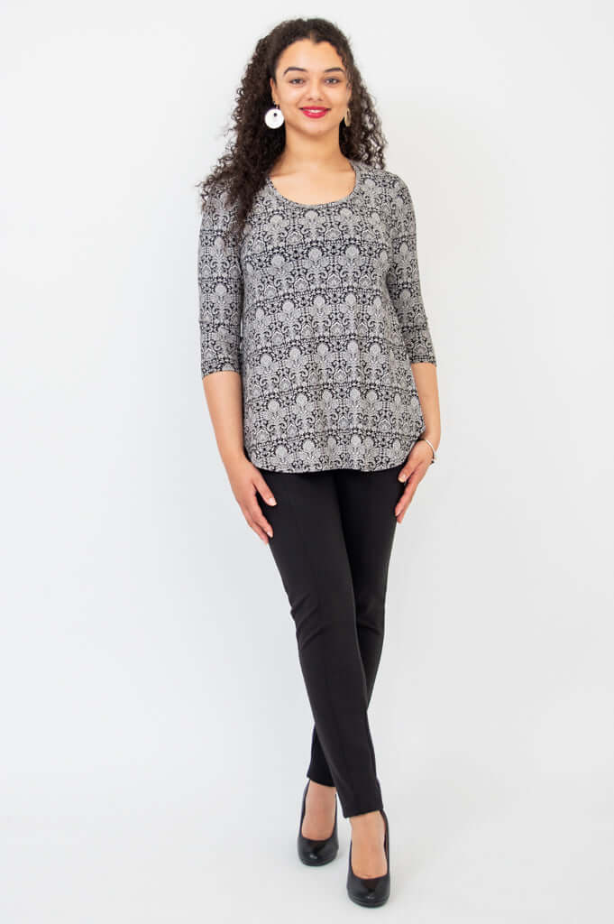 Model standing straight in Jazz Bamboo Top, black damask print, paired with black pants