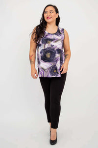 Woman in Jazz Tank Lotus Flow, walking forward and smiling, front angle