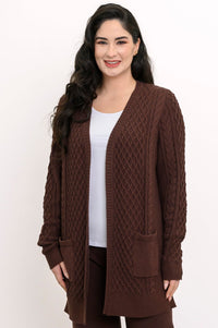 Studio portrait showcasing a dark brown open v-front cable knit sweater with long sleeves.