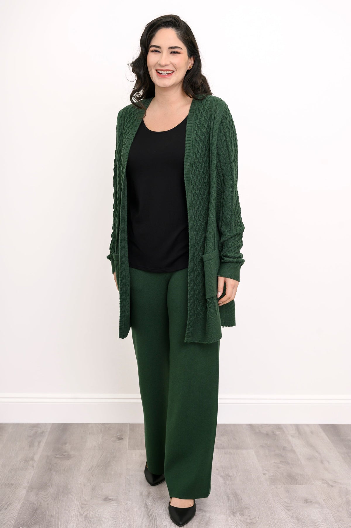 Women's casual dark green lounge pants worn with a coordinating long cardigan as a matching set, front-facing.