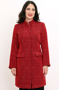 Woman wearing red collared coat with pockets and a black skirt on a white background, front view