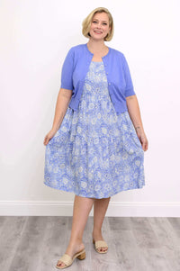 Front view of the Juni Dress in blue floral with lavender cardigan