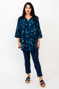 Model posing front-on in the Kary Tunic Top with matching indigo pants